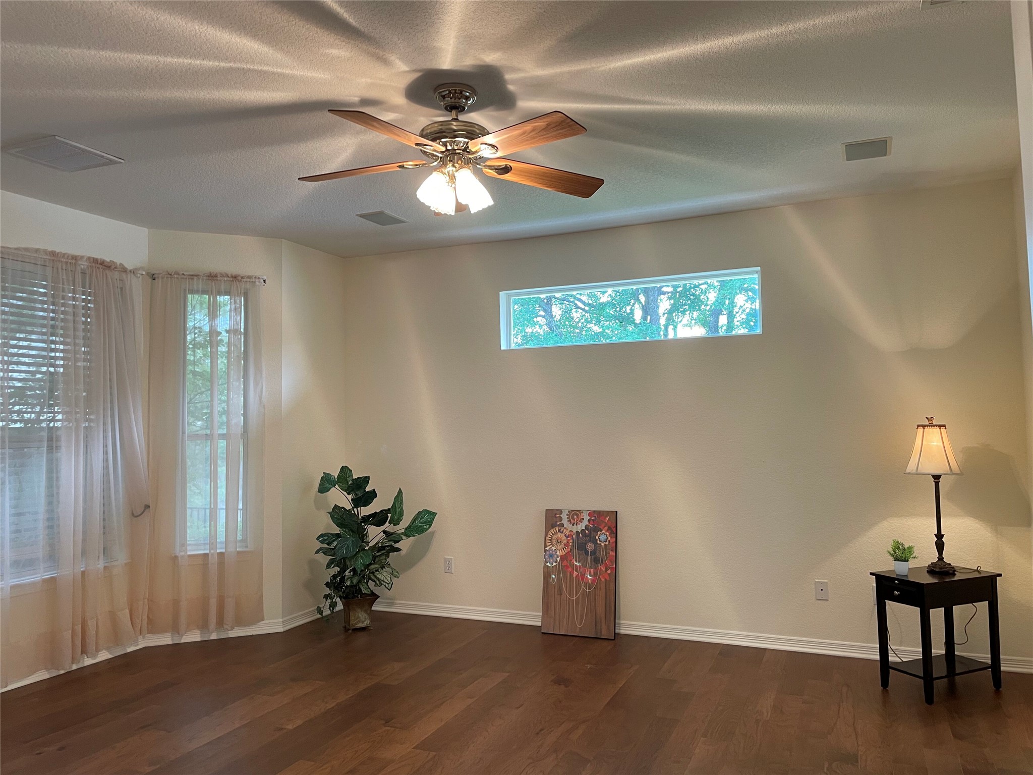 120 Brazos Drive Georgetown, TX 78628 - Photo 20 of 33 a view of an empty room with wooden floor and a window