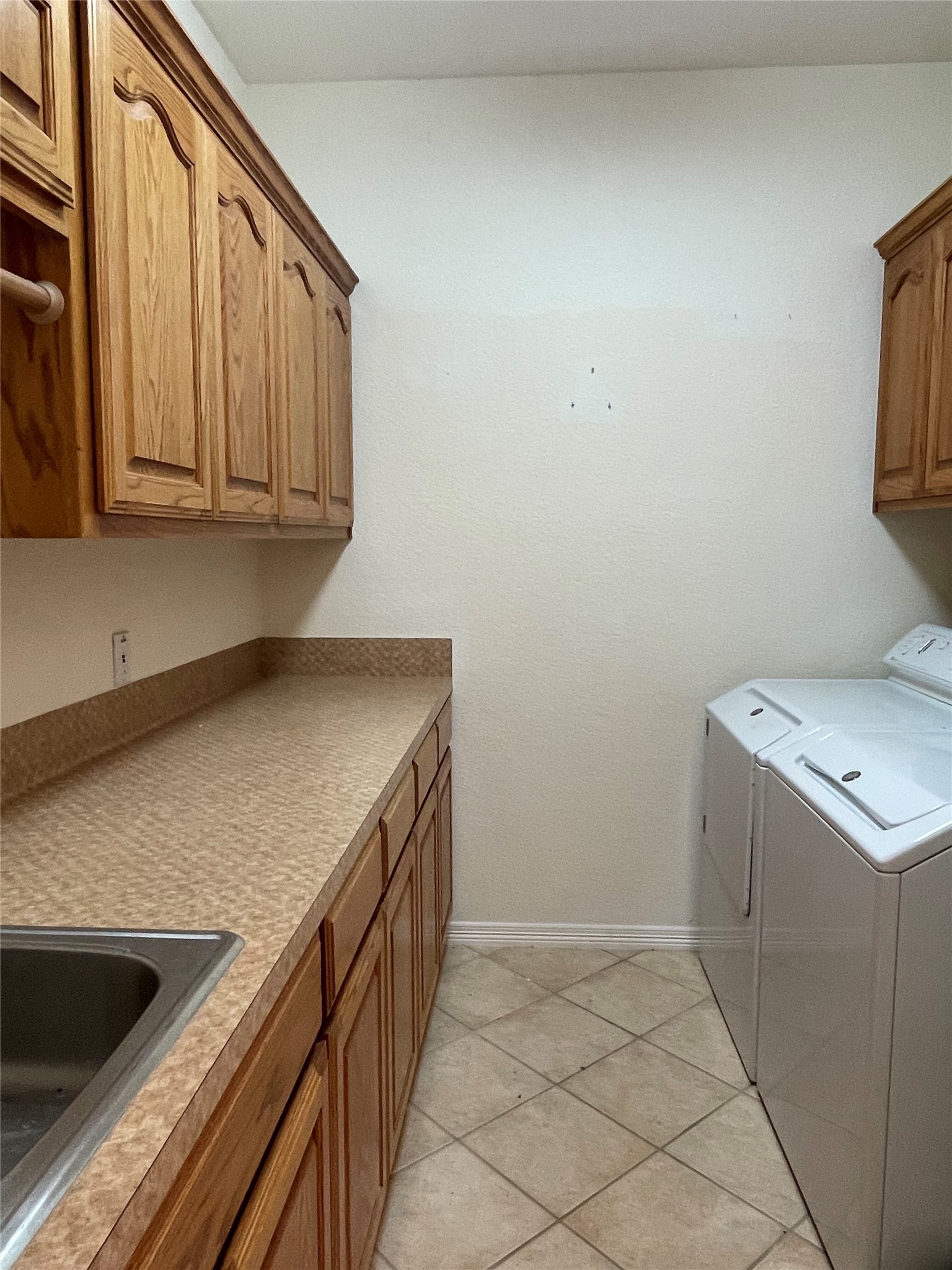120 Brazos Drive Georgetown, TX 78628 - Photo 33 of 33 a kitchen with a sink cabinets and utility