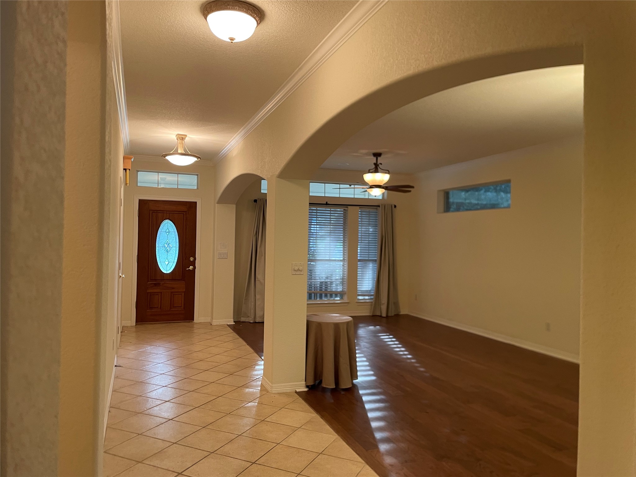 120 Brazos Drive Georgetown, TX 78628 - Photo 5 of 33 a view of a hallway with wooden floor and windows