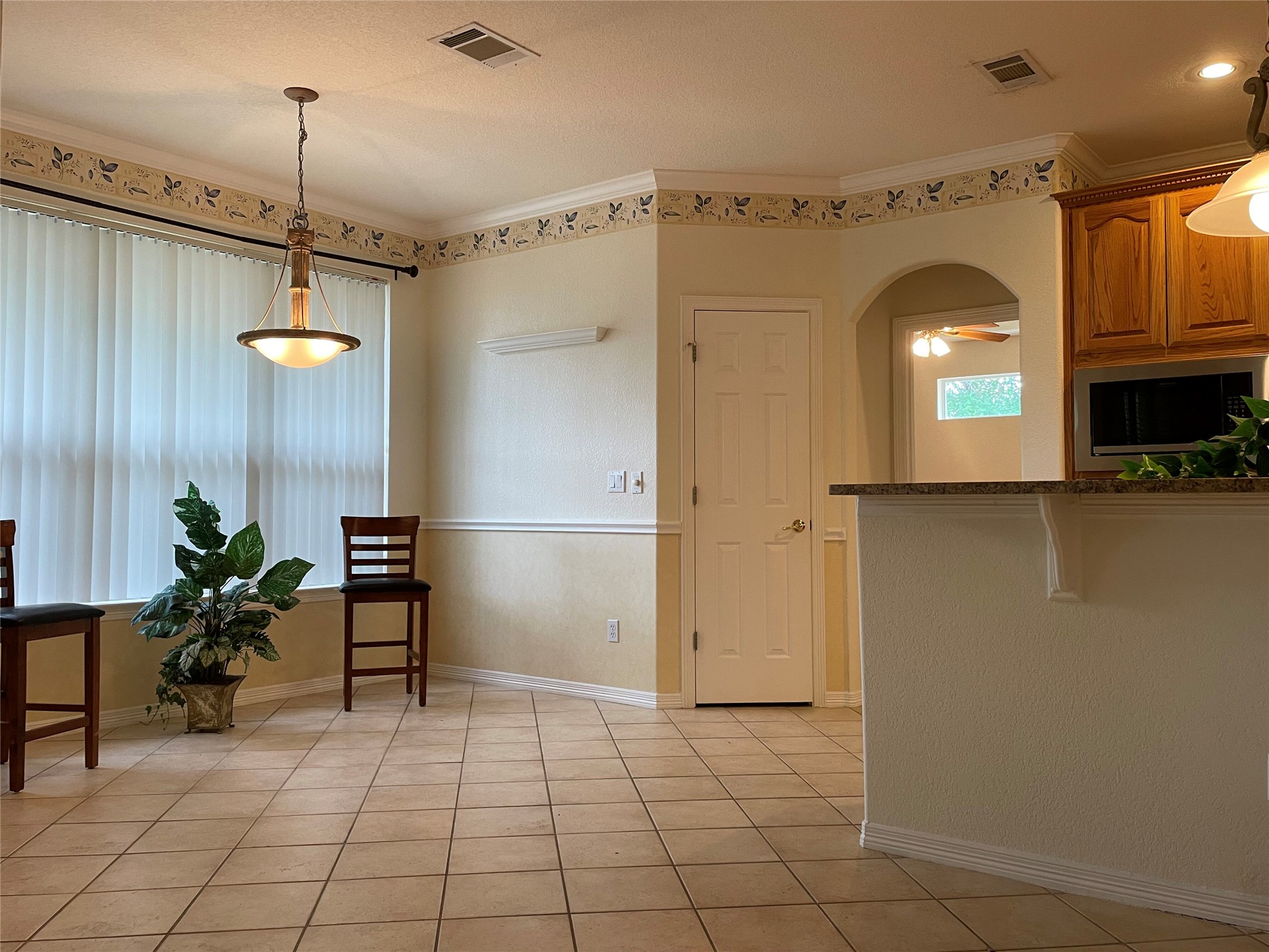 120 Brazos Drive Georgetown, TX 78628 - Photo 8 of 33 a view of a hallway with wooden floor and a cabinet