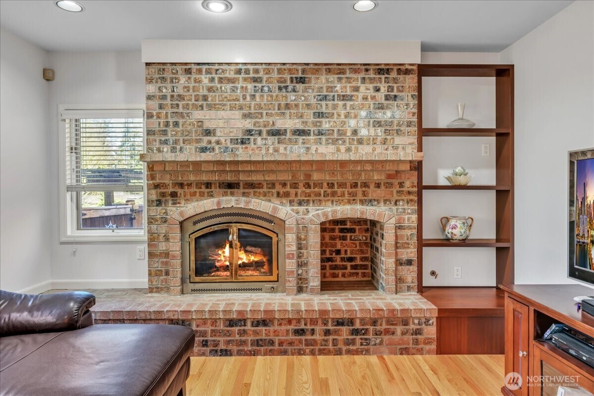 7929 Cyrus Place Edmonds, WA 98026 - Photo 11 of 34 a living room with furniture and a fireplace