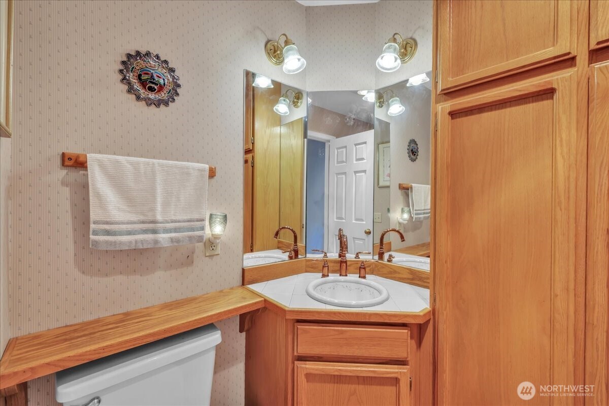 7929 Cyrus Place Edmonds, WA 98026 - Photo 12 of 34 a bathroom with a sink and a mirror
