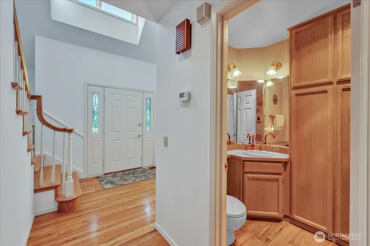 7929 Cyrus Place Edmonds, WA 98026 - Photo 13 of 34 a bathroom with a sink a toilet and shower