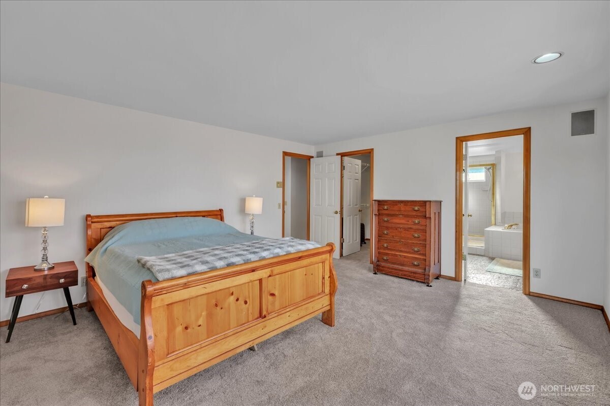 7929 Cyrus Place Edmonds, WA 98026 - Photo 19 of 34 a bedroom with a bed and dresser