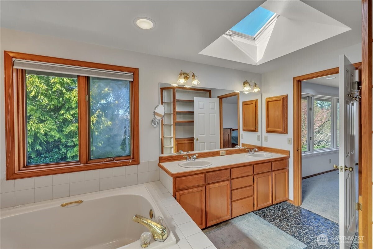 7929 Cyrus Place Edmonds, WA 98026 - Photo 23 of 34 a room with a bed and a large window