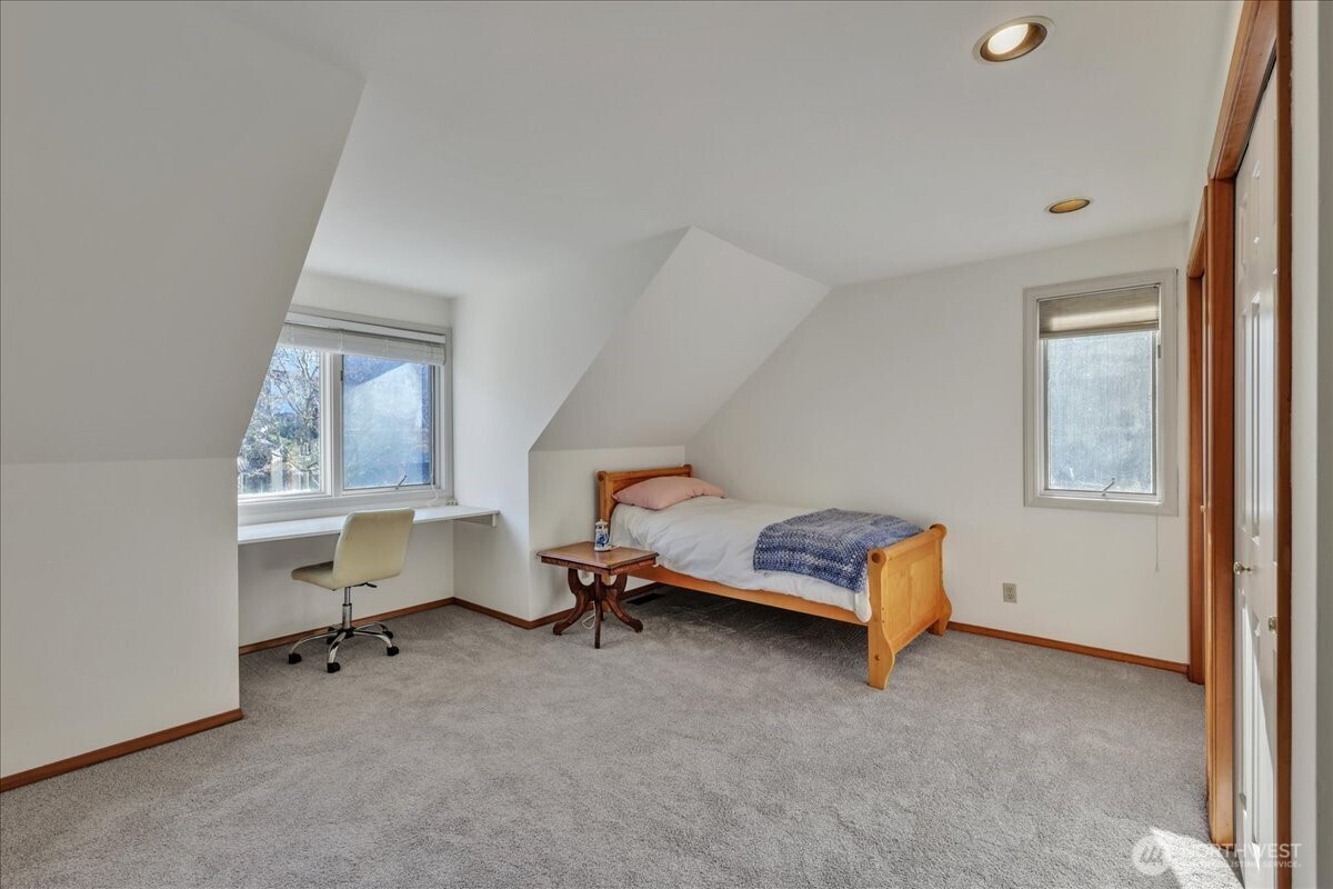 7929 Cyrus Place Edmonds, WA 98026 - Photo 25 of 34 a bedroom with a bed and a window