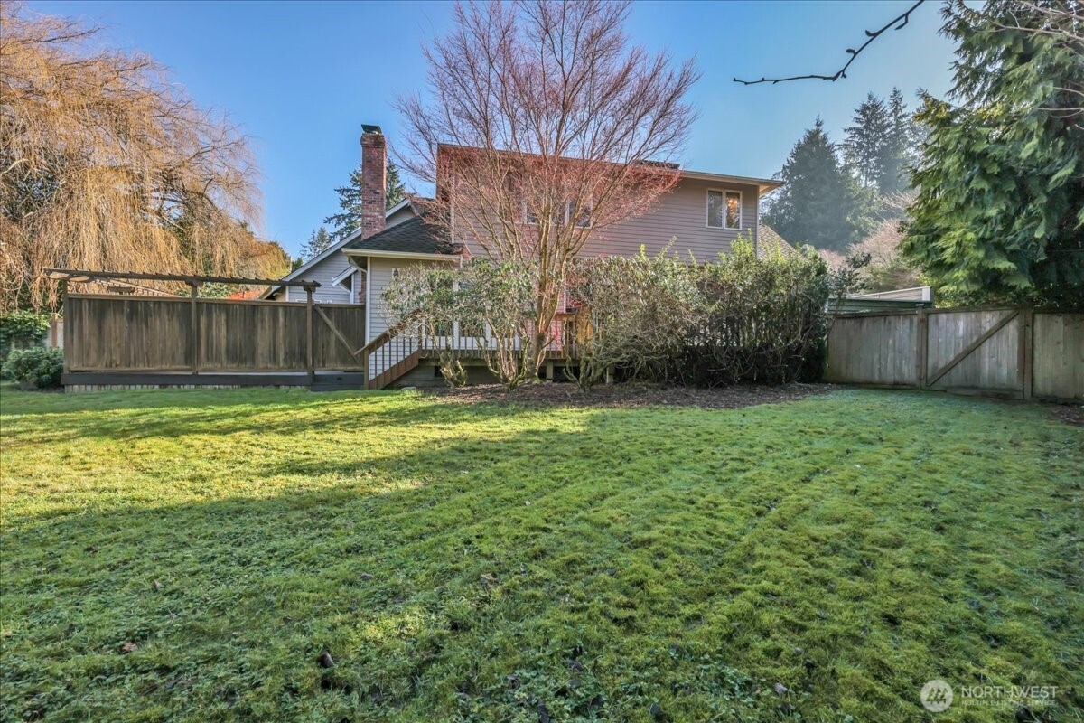 7929 Cyrus Place Edmonds, WA 98026 - Photo 29 of 34 a view of a backyard with a small cabin