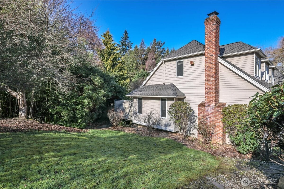 7929 Cyrus Place Edmonds, WA 98026 - Photo 30 of 34 a front view of a house with garden