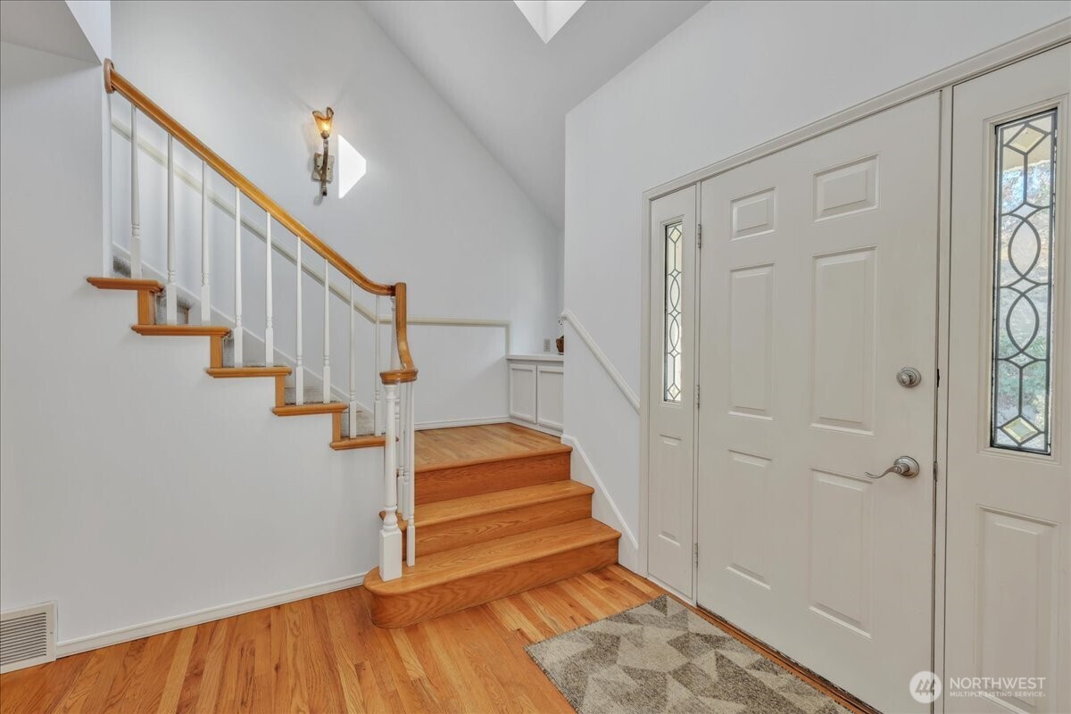7929 Cyrus Place Edmonds, WA 98026 - Photo 3 of 34 a view of entryway and hall with wooden floor