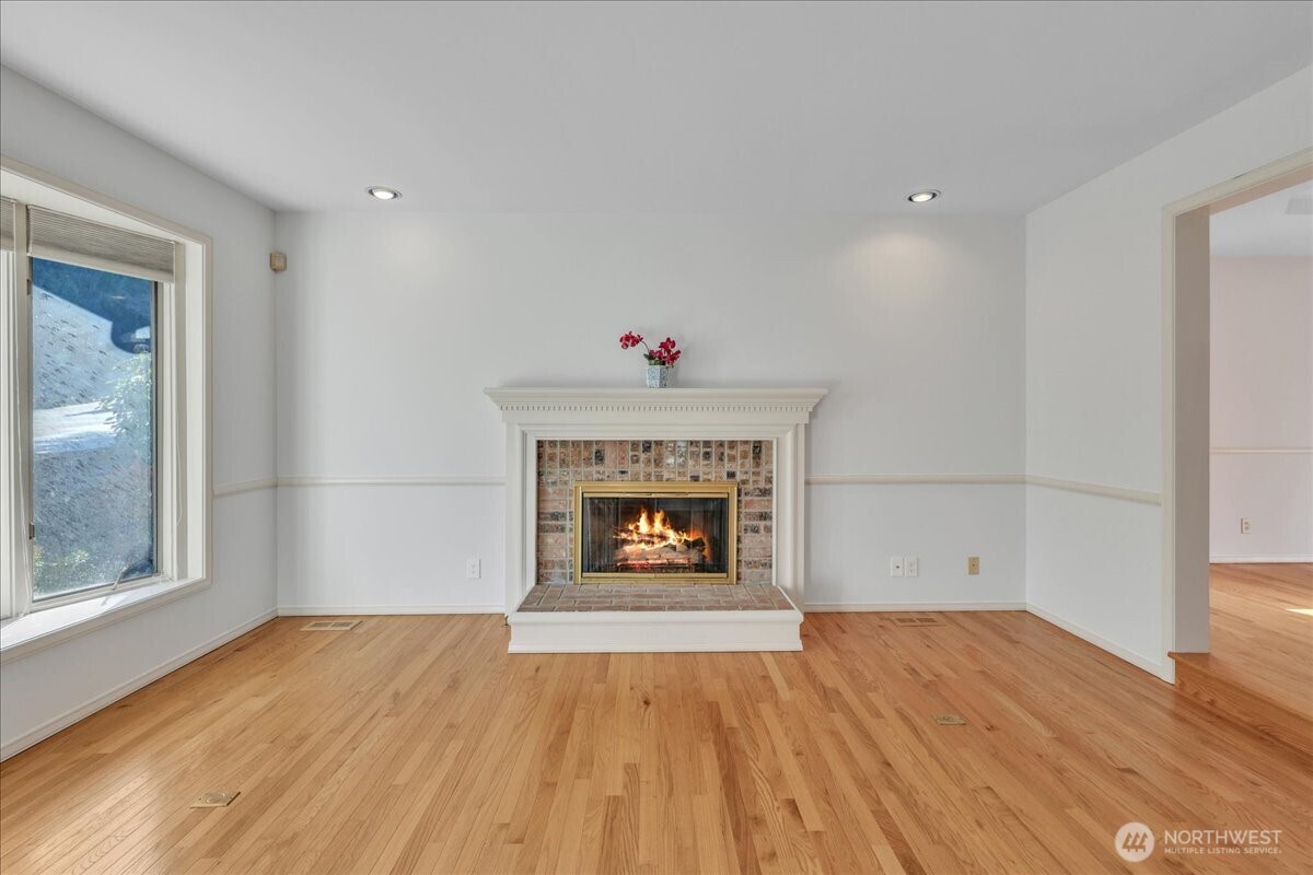 7929 Cyrus Place Edmonds, WA 98026 - Photo 4 of 34 wooden floor in an empty room with a window