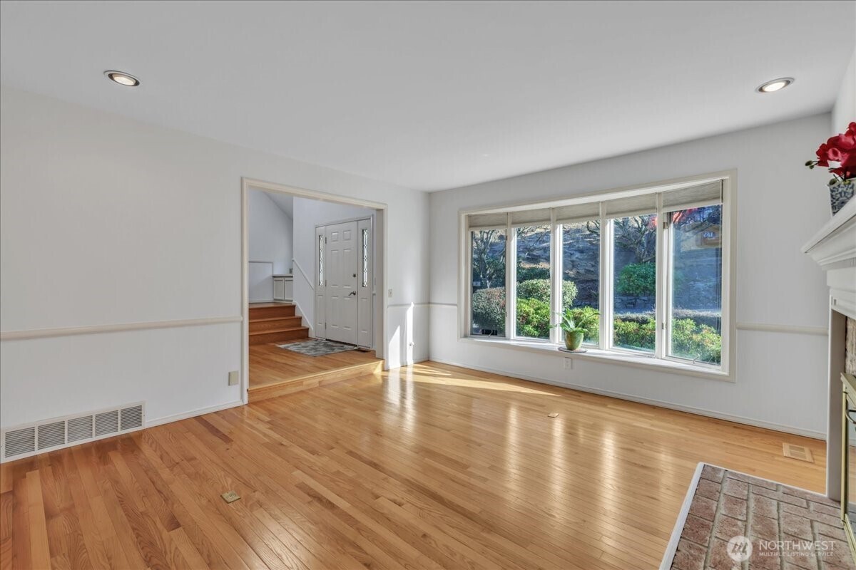 7929 Cyrus Place Edmonds, WA 98026 - Photo 5 of 34 a view of empty room with wooden floor and fan