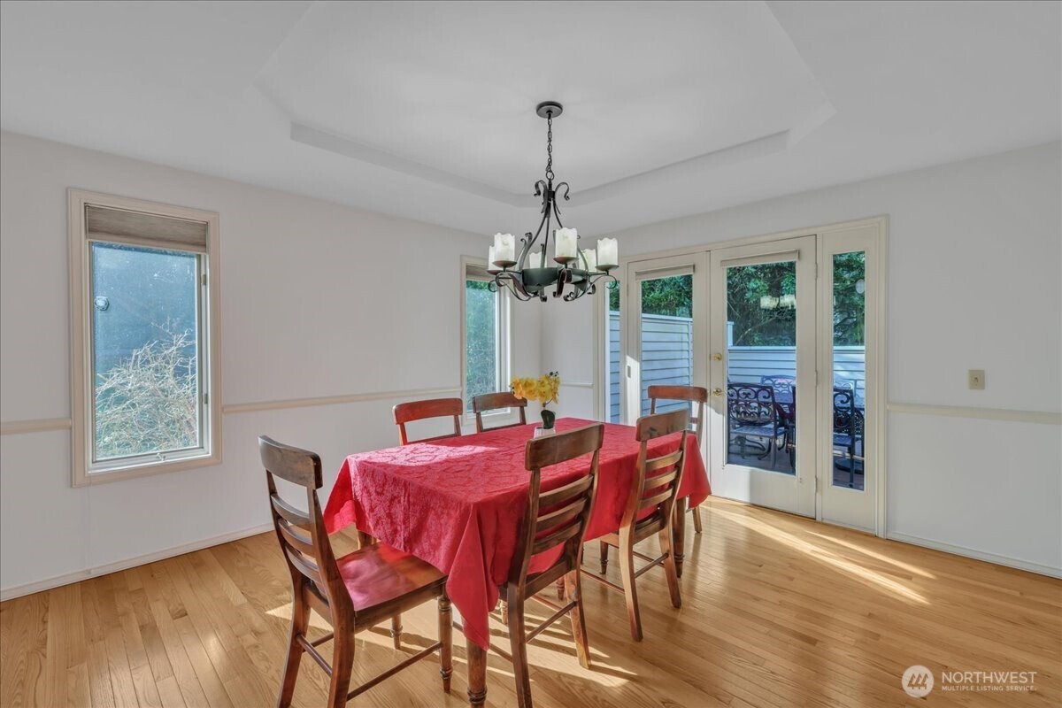 7929 Cyrus Place Edmonds, WA 98026 - Photo 6 of 34 a view of a dining room with furniture window and wooden floor