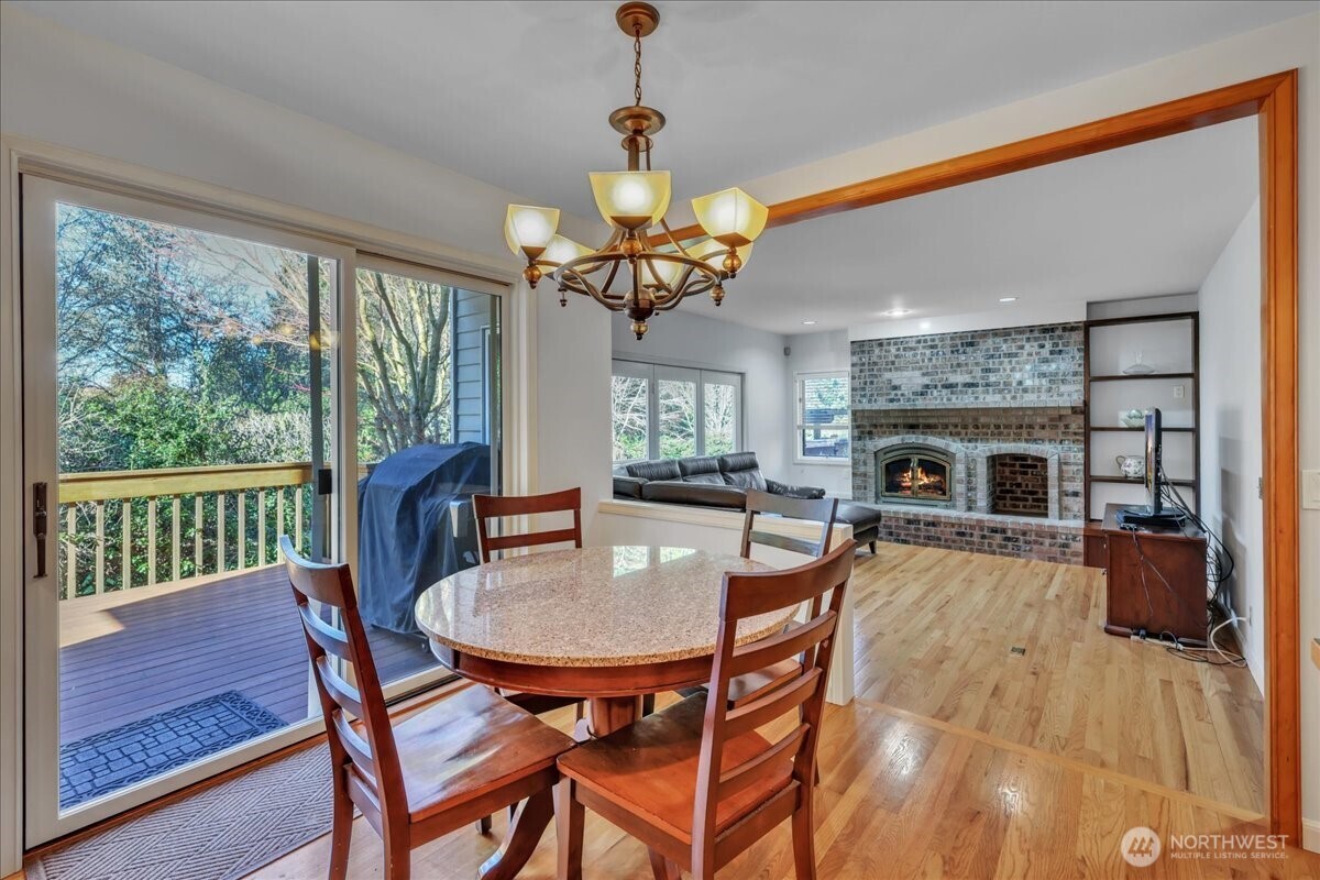 7929 Cyrus Place Edmonds, WA 98026 - Photo 9 of 34 a dining room with furniture a chandelier and window