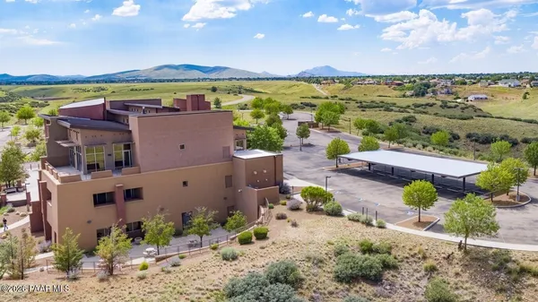 a front view of a building with a yard