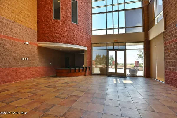 a view of a hallway with seating area
