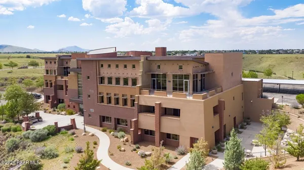 a view of a building with a snow on the road