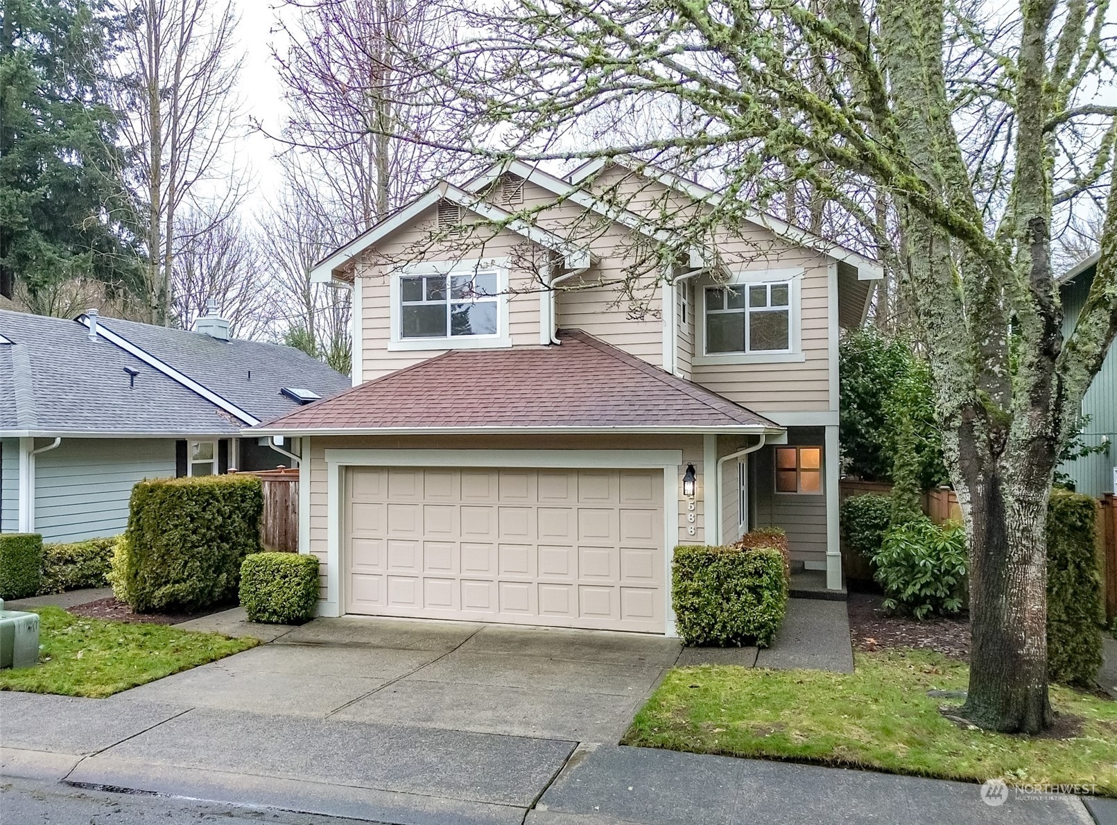 4566 Beckonridge Loop Southeast Lacey, WA 98513 - Photo 1 of 37 a front view of a house with a garden
