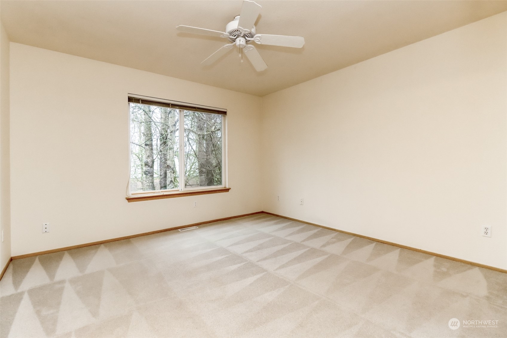 4566 Beckonridge Loop Southeast Lacey, WA 98513 - Photo 19 of 37 an empty room with windows and fan