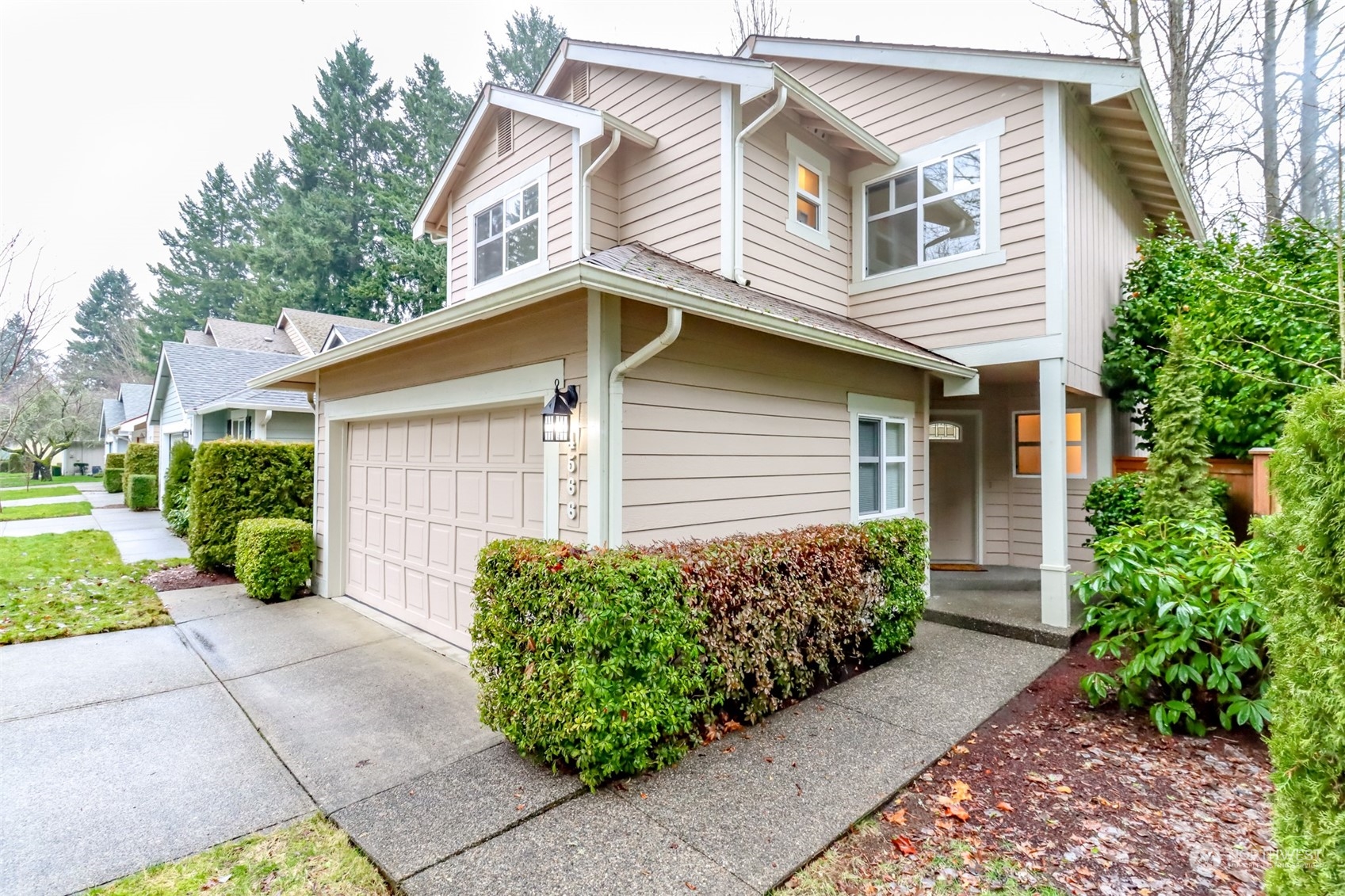 4566 Beckonridge Loop Southeast Lacey, WA 98513 - Photo 2 of 37 a view of a house with a small yard and plants