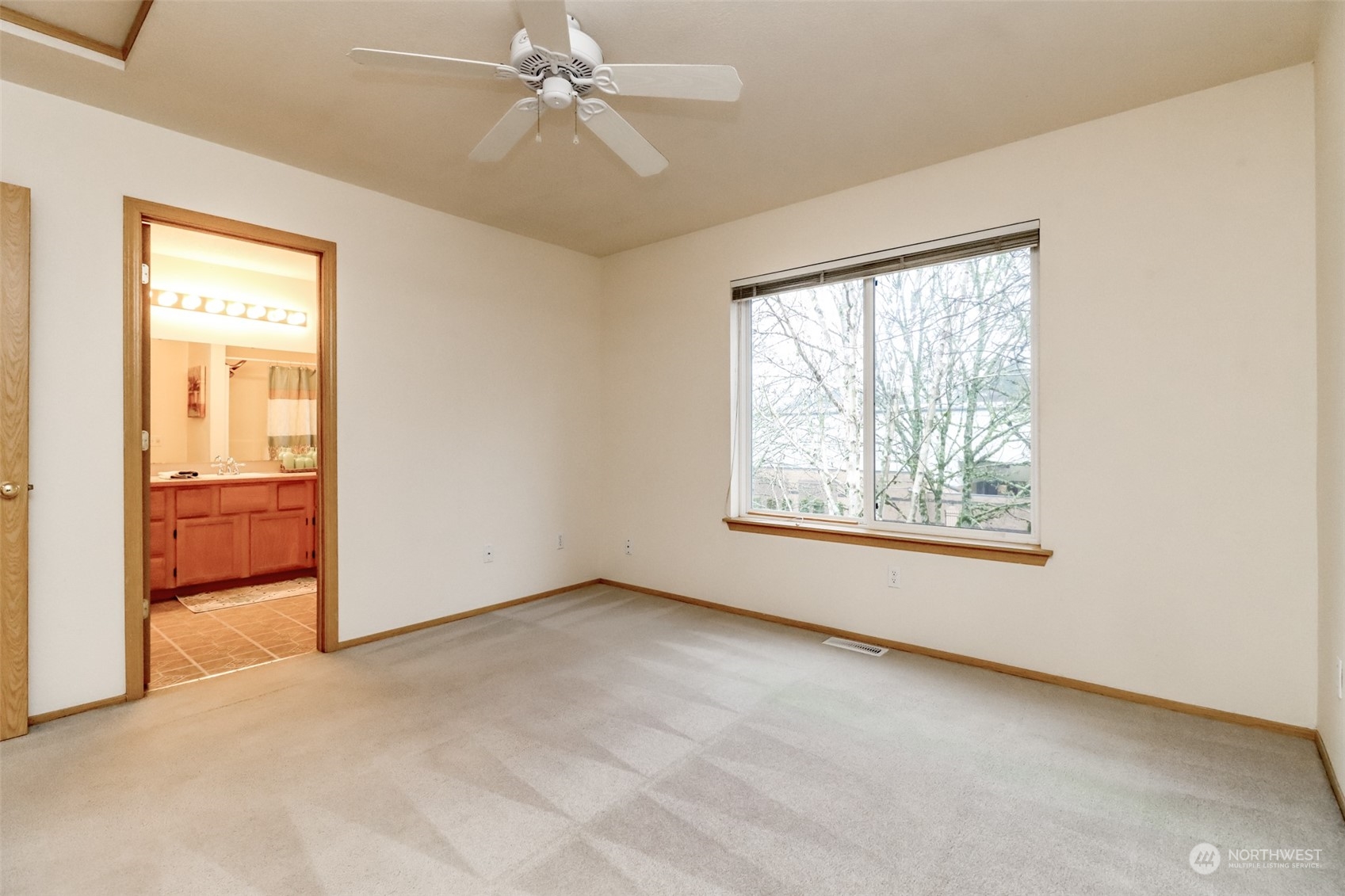 4566 Beckonridge Loop Southeast Lacey, WA 98513 - Photo 23 of 37 an empty room with windows and fan