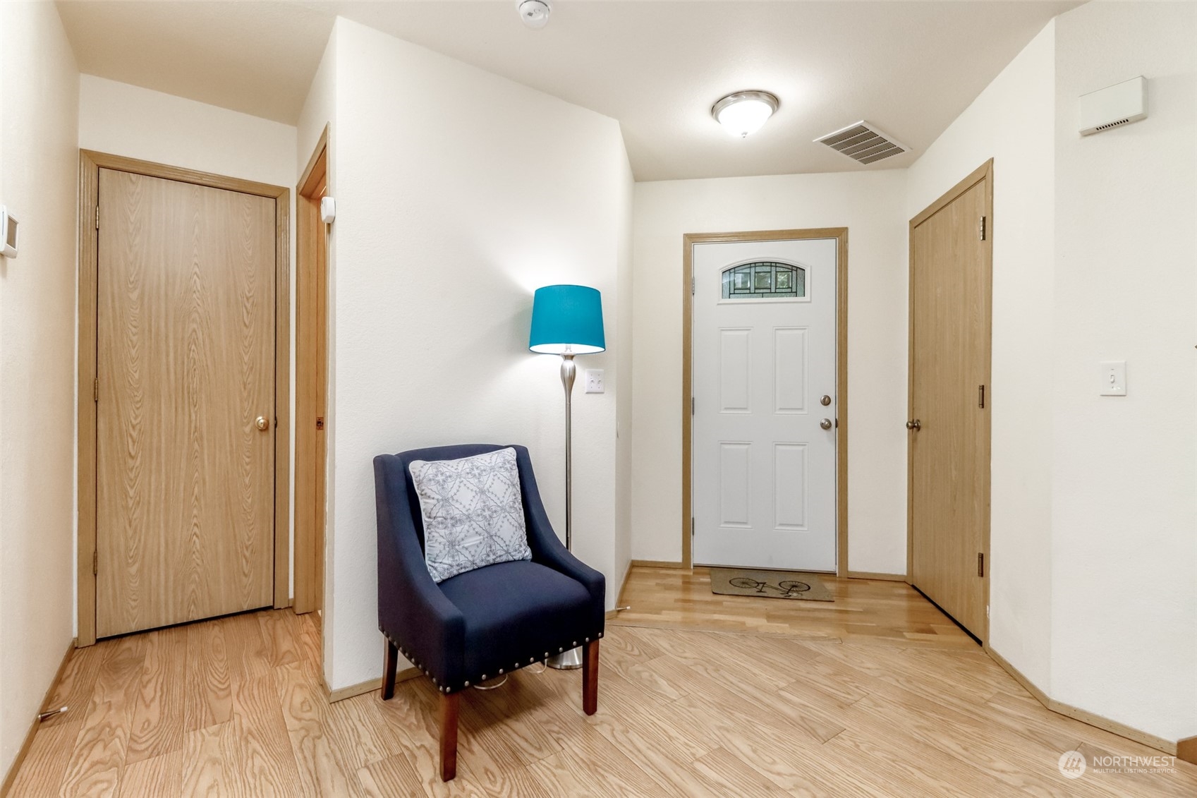 4566 Beckonridge Loop Southeast Lacey, WA 98513 - Photo 3 of 37 a view of room with a window and wooden floor