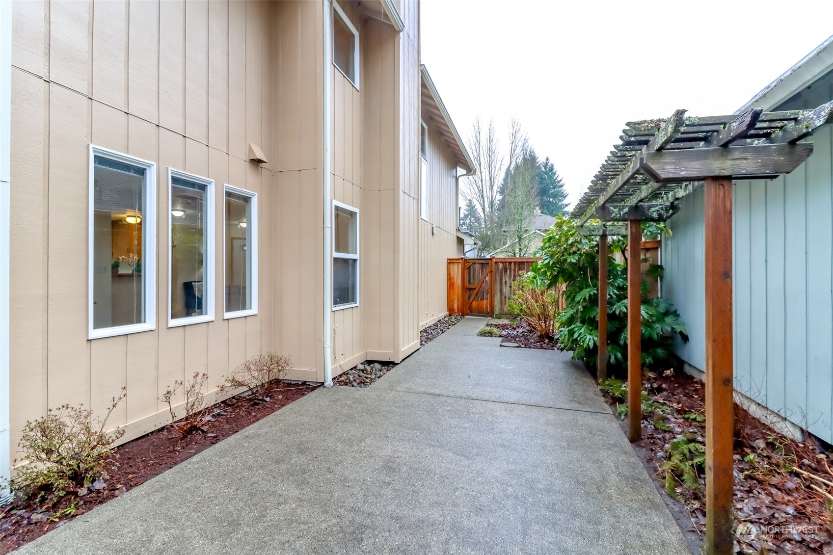 4566 Beckonridge Loop Southeast Lacey, WA 98513 - Photo 33 of 37 a view of a house with potted plants