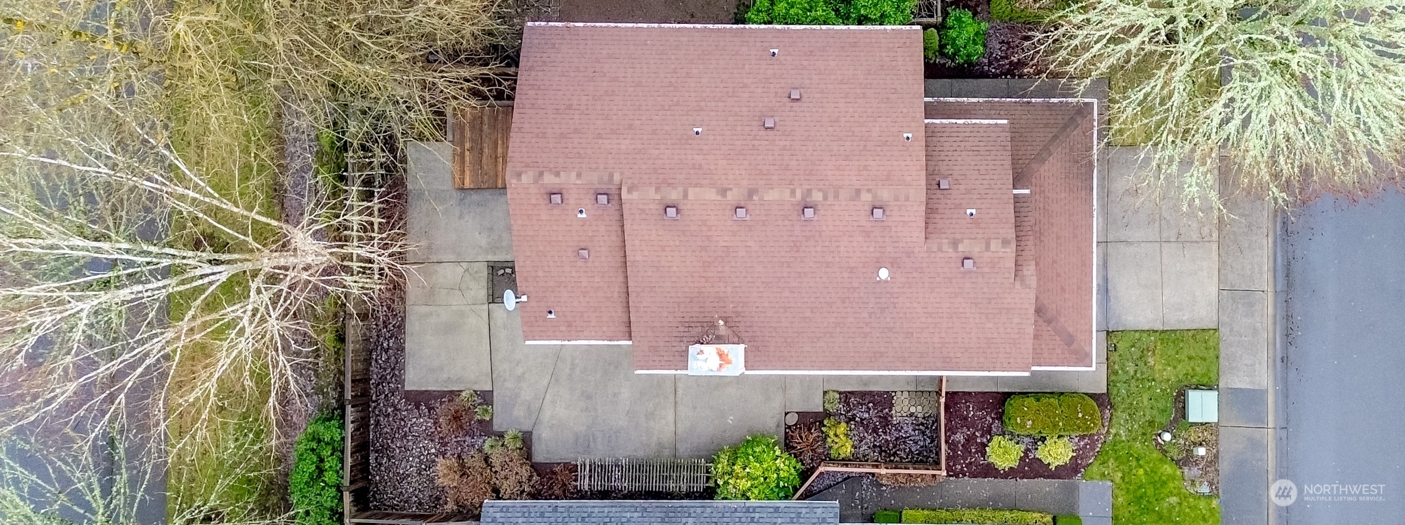 4566 Beckonridge Loop Southeast Lacey, WA 98513 - Photo 36 of 37 aerial view of a house with a yard and plants