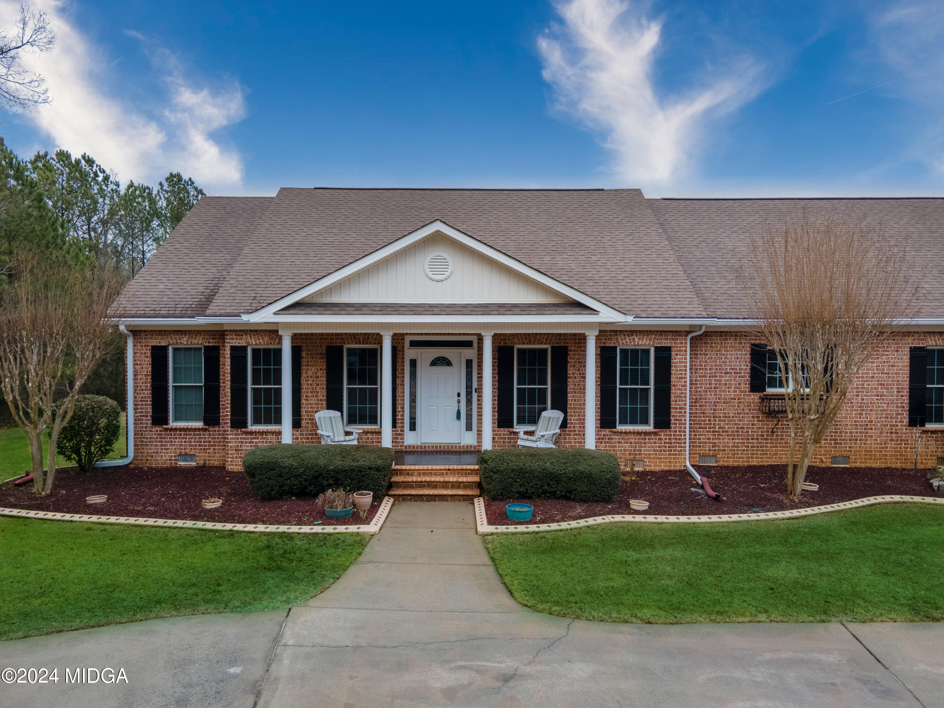 1298 Head Road Juliette, GA 31046 - Photo 3 of 90 a front view of a house with a garden and plants