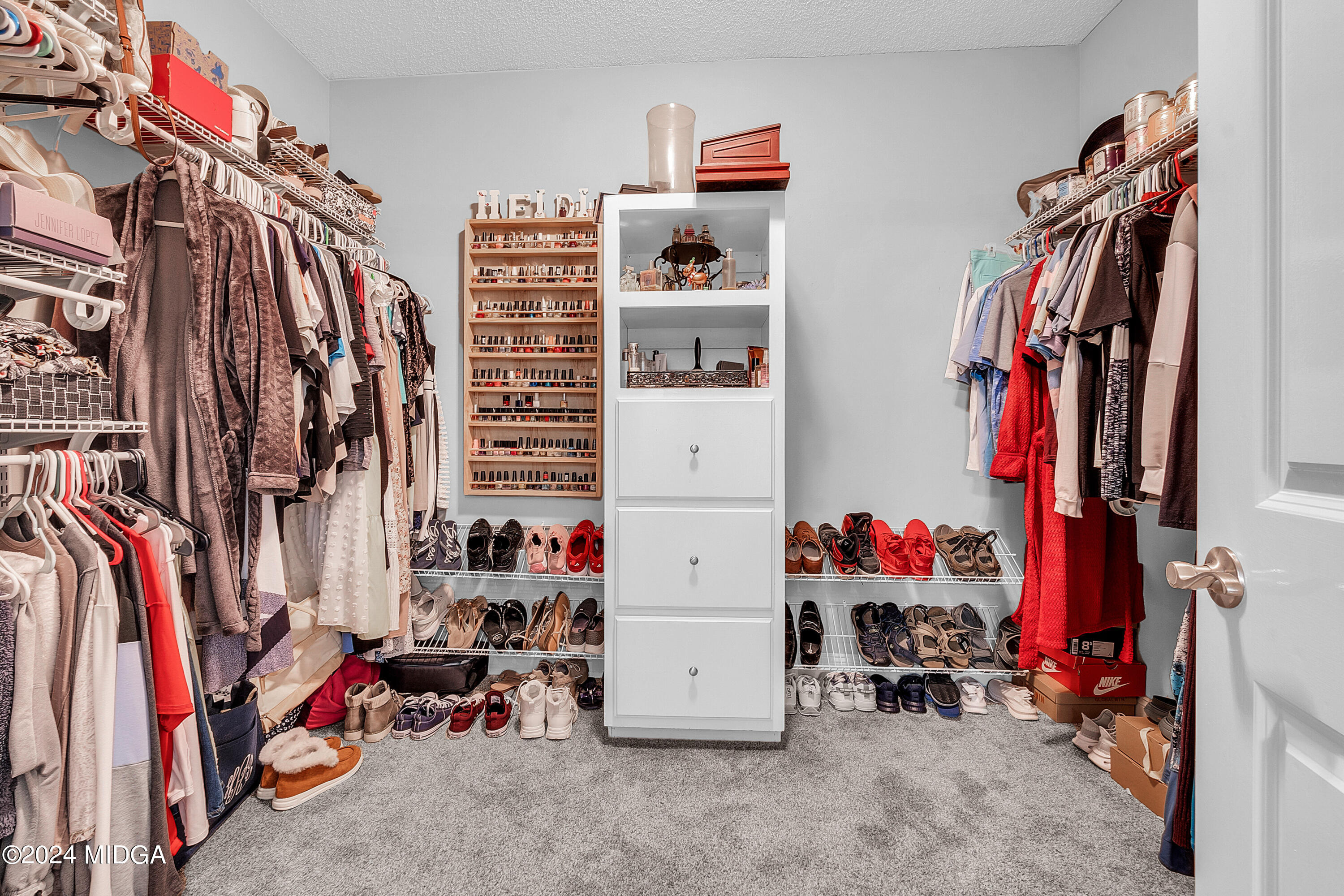1298 Head Road Juliette, GA 31046 - Photo 43 of 90 a view of walk in closet with clothes and shoes