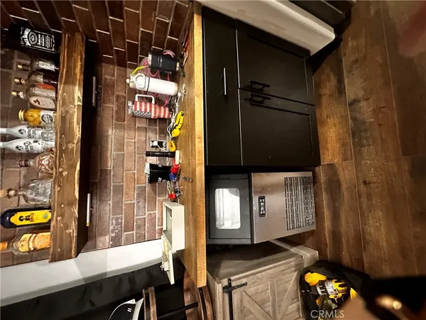 a kitchen with granite countertop a sink a stove and cabinets