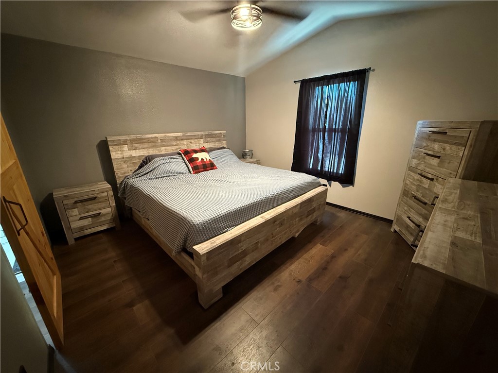 50918 Parker Dam Road, Unit 121 Earp, CA 92242 - Photo 16 of 24 a bed sitting in a bedroom next to a window