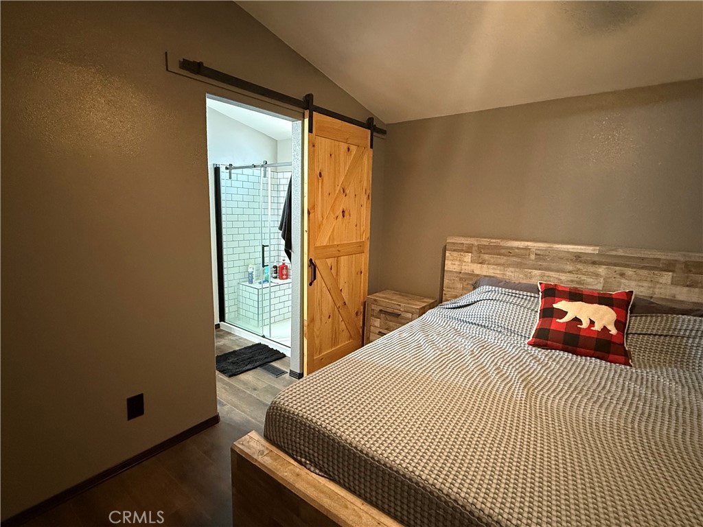 50918 Parker Dam Road, Unit 121 Earp, CA 92242 - Photo 17 of 24 a bedroom with a bed and a dresser