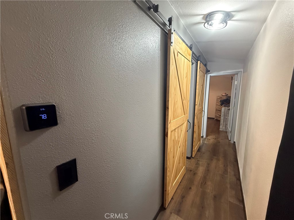 50918 Parker Dam Road, Unit 121 Earp, CA 92242 - Photo 21 of 24 a view of hallway with wooden floor and furniture