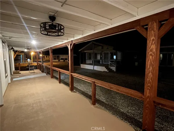 a view of an empty room with furniture