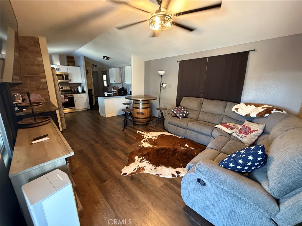 50918 Parker Dam Road, Unit 121 Earp, CA 92242 - Photo 9 of 24 a living room with furniture and a flat screen tv