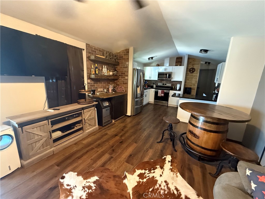 50918 Parker Dam Road, Unit 121 Earp, CA 92242 - Photo 10 of 24 a kitchen with stainless steel appliances granite countertop a stove and a refrigerator