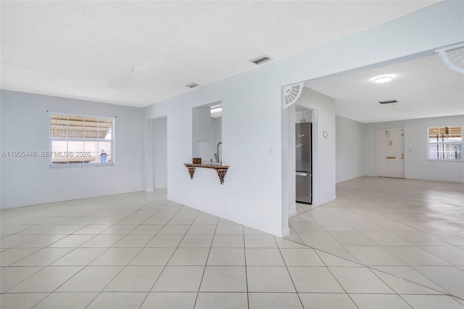 1005 Southwest 18th Street Boynton Beach, FL 33426 - Photo 11 of 44 a view of an empty room and a window