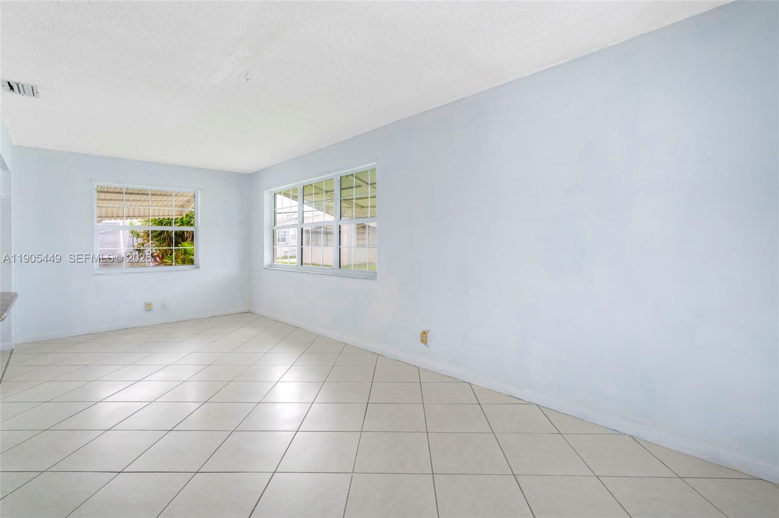 1005 Southwest 18th Street Boynton Beach, FL 33426 - Photo 13 of 44 an empty room with windows