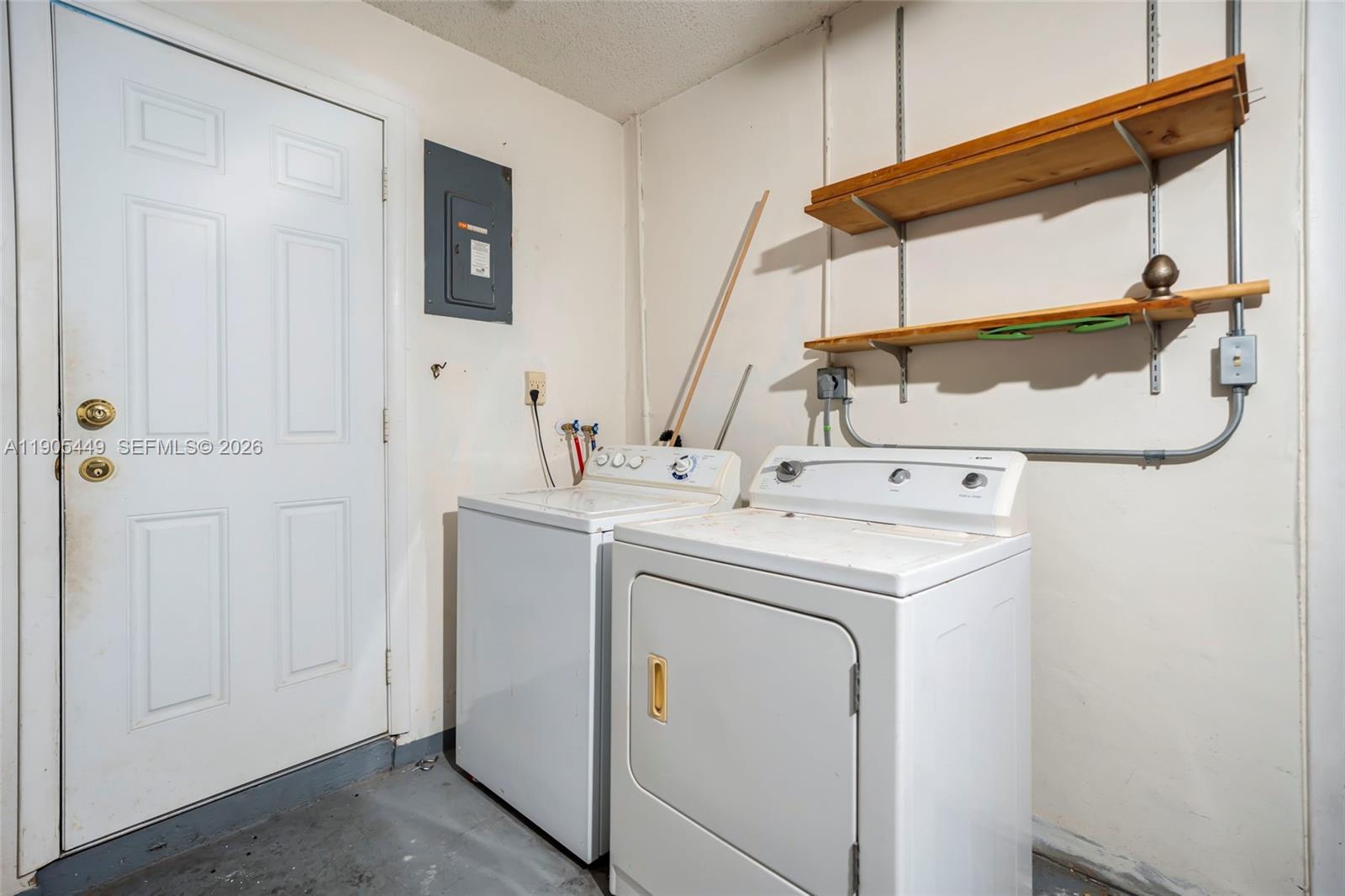 1005 Southwest 18th Street Boynton Beach, FL 33426 - Photo 19 of 44 a utility room with dryer and washer