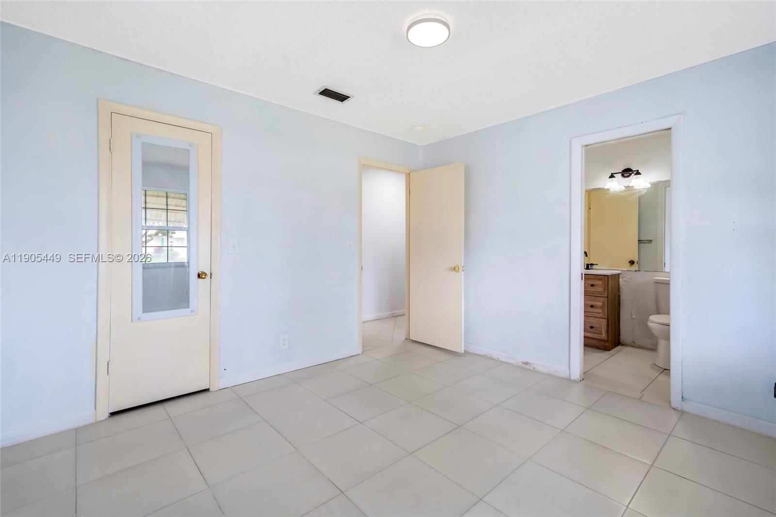 1005 Southwest 18th Street Boynton Beach, FL 33426 - Photo 23 of 44 an empty room with kitchen view