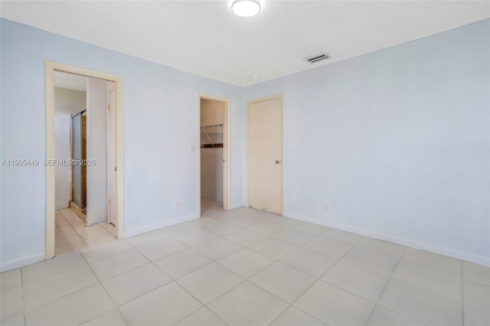 1005 Southwest 18th Street Boynton Beach, FL 33426 - Photo 25 of 44 a view of an empty room and closet area