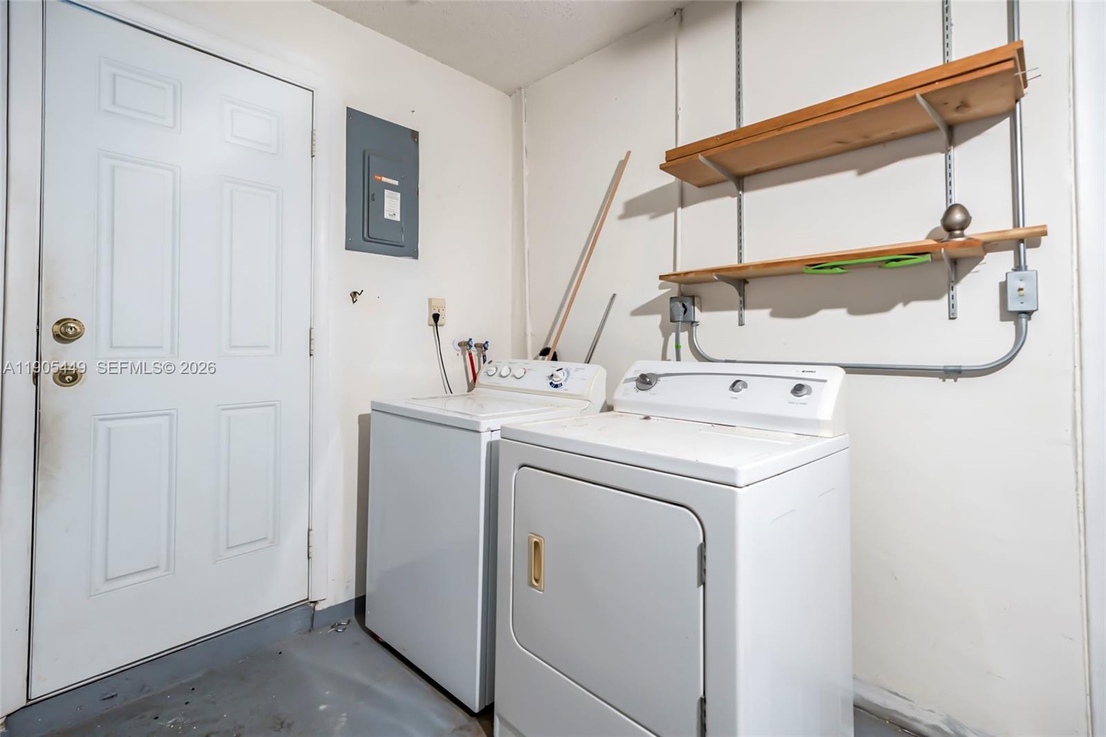 1005 Southwest 18th Street Boynton Beach, FL 33426 - Photo 27 of 44 a utility room with dryer and washer