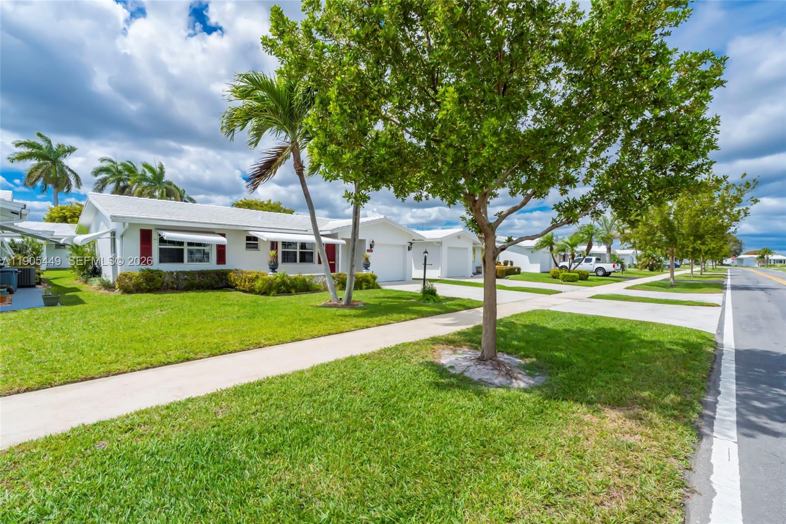 1005 Southwest 18th Street Boynton Beach, FL 33426 - Photo 33 of 44 a house with garden in front of it
