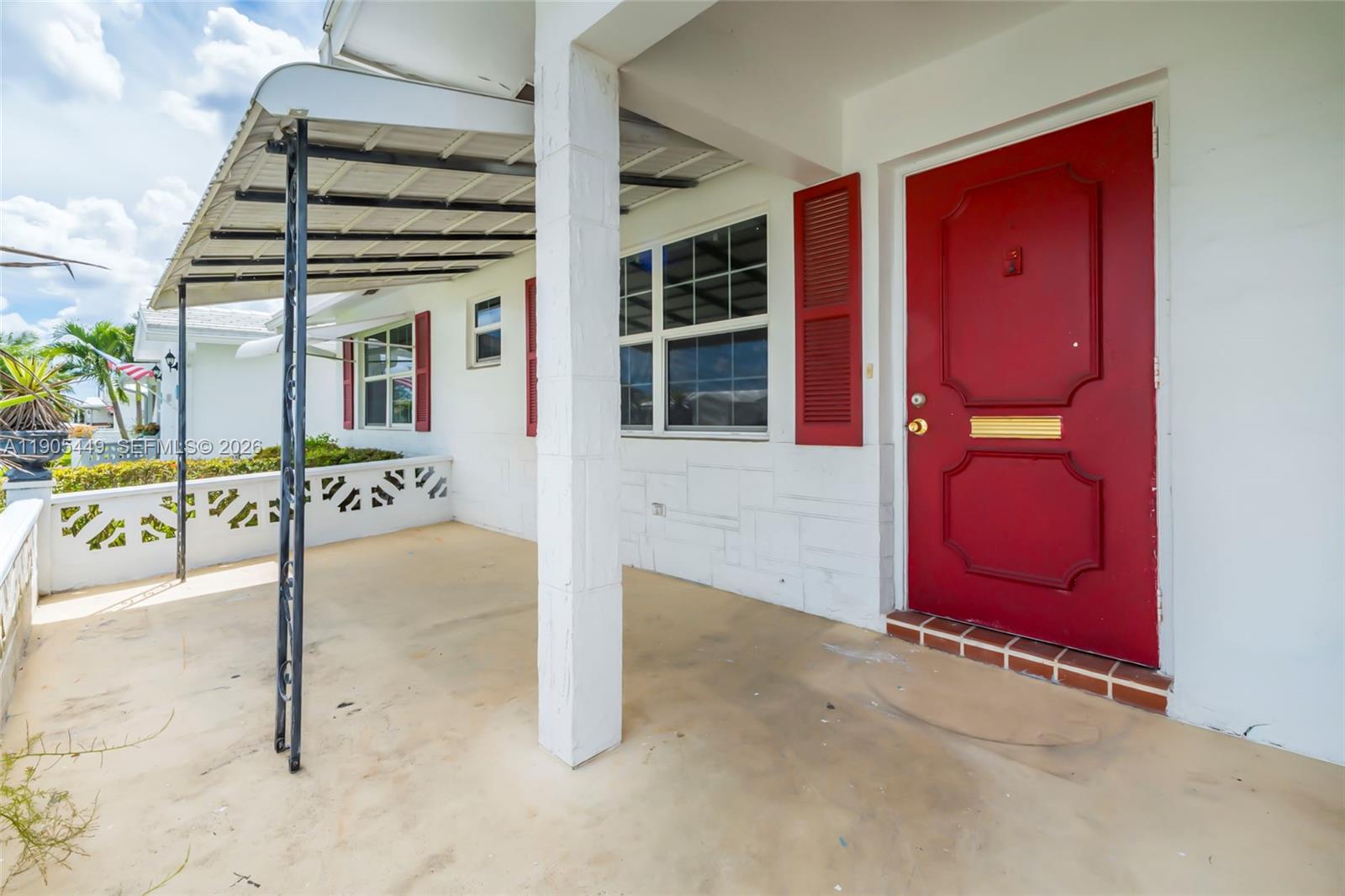 1005 Southwest 18th Street Boynton Beach, FL 33426 - Photo 37 of 44 front view of a house with a garage