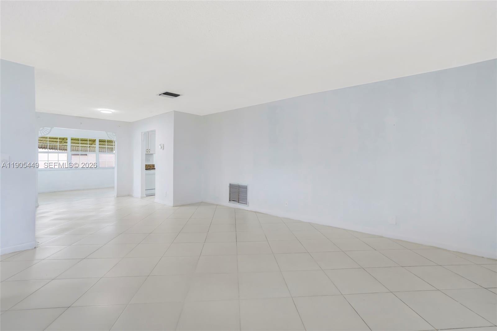1005 Southwest 18th Street Boynton Beach, FL 33426 - Photo 4 of 44 an empty room with windows