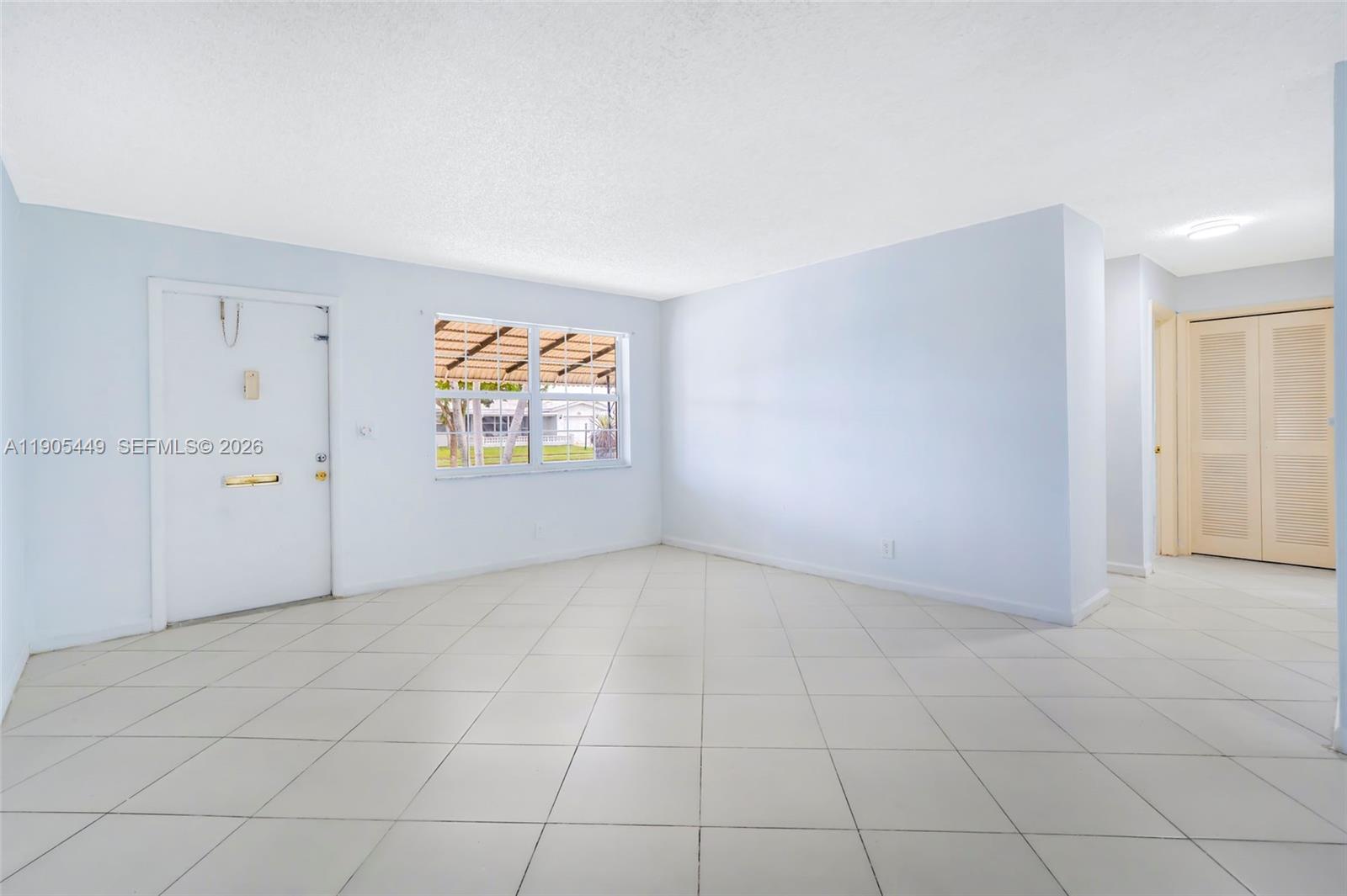 1005 Southwest 18th Street Boynton Beach, FL 33426 - Photo 6 of 44 an empty room with windows