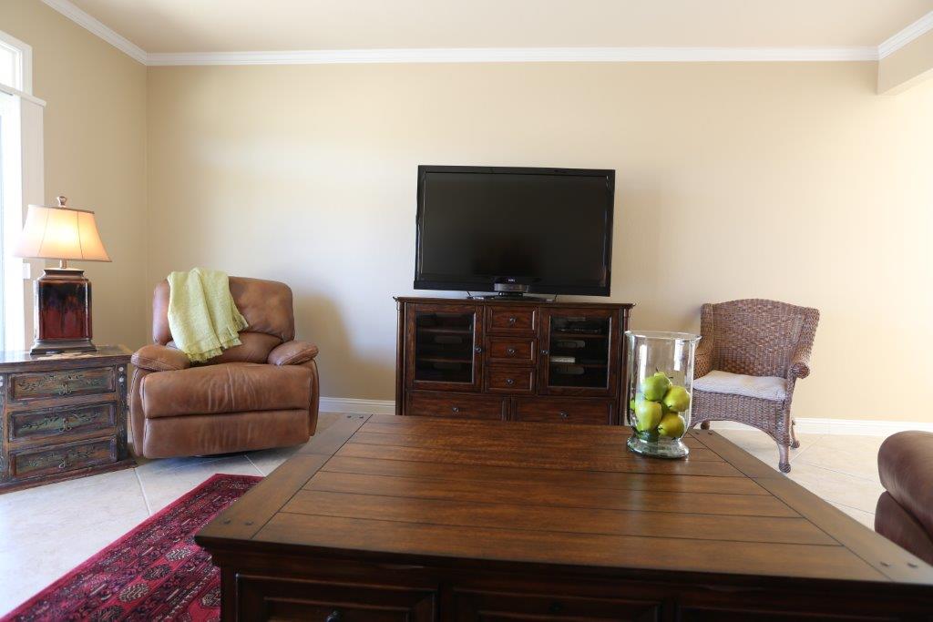 109 Ranier Lane Georgetown, TX 78633 - Photo 8 of 18 Clean lines and a spacious layout create a comfortable living space with crown molding and ceramic tile flooring.