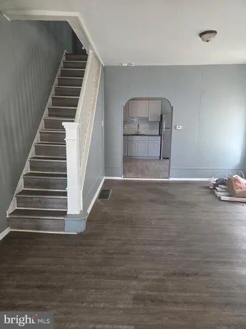 a view of a livingroom with wooden floor