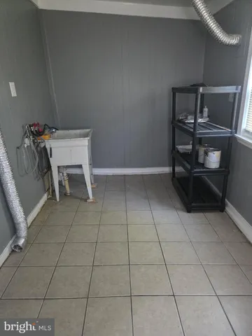 a view of kitchen with furniture and window