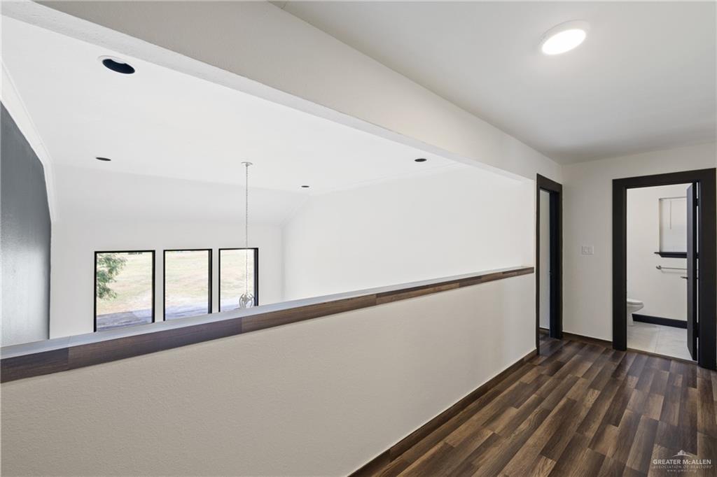 2018 Sabinal Street Mission, TX 78572 - Photo 11 of 20 a view of an empty room with window and wooden floor